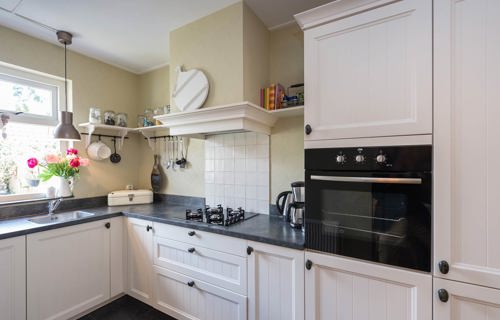 Landelijke keuken met prachtige schouw